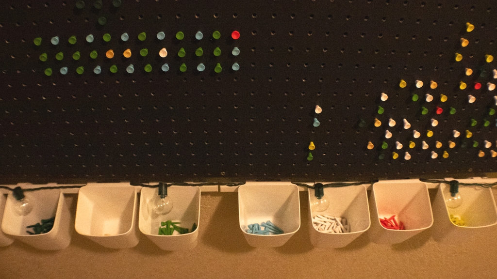 Kids interactive art display pegboard cups