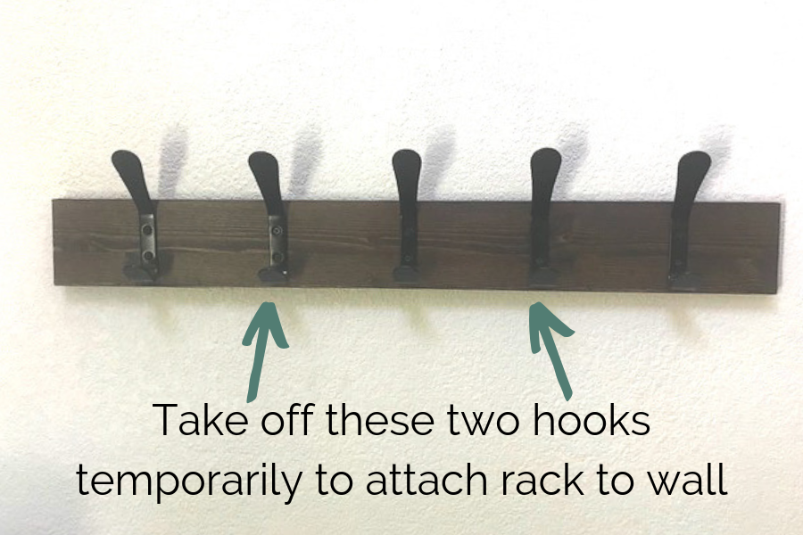 Instructions for hiding screws when attaching coat rack to the wall