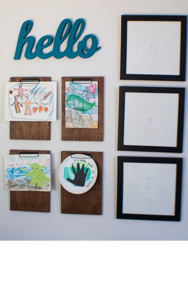 Gallery Wall featuring kids art and spray painted matboard pictionary drawings