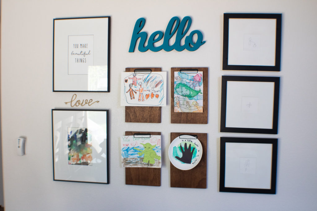 Gallery wall featuring DIY wood clipboards